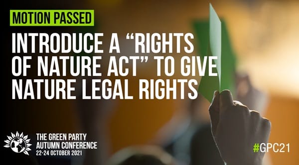 Text saying a Rights of Nature Act motion has passed, with a conference background